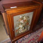 An Edwardian inlaid mahogany pier cabinet with glazed panel on bun feet