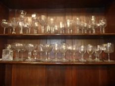 A collection of liquor glasses and champagne glasses