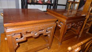 A pair of Chinese style fruitwood low tables