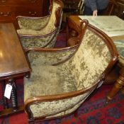 A pair of Regency style mahogany tub chairs with swan relief