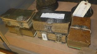 A set of five silver plated mounted bibles