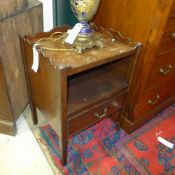 A George III mahogany commode the tray top above shelf and drawer
