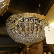 A pair of cut glass and brass ceiling lights