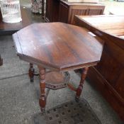A late Victorian walnut centre table the octagonal top united by gallery undertier