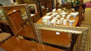 A gilded rectangular wall mirror and a smaller similar