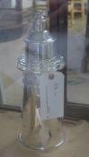 A silver plated cocktail shaker in the form of a lighthouse