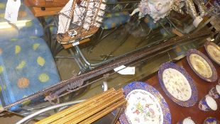 A collection of three hardwood Amazonian bows