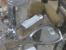 A Secessionist plated mirror with a silver handled brush set