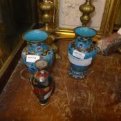A pair of turquoise Chinese cloisonne vases and a Japanese cloisonne vase