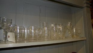 A collection of cut glass drinking including tumblers, wine glasses and others