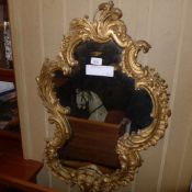 A late C19th gilded pier mirror the shaped plate and carved acanthus frame