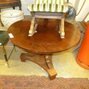 A C19th continental mahogany occasional table the circular top on down swept supports united by