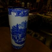 A blue and white umbrella stand