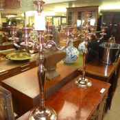 A pair of copper five branch candelabra