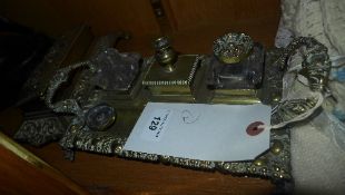 Two brass mounted inkwells one twin handled with two inverted glass inkwells and a similar classical