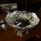 A silver plated embossed punch bowl