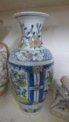A bulbous Delft vase decorated with floral patterns in geometric cartouches