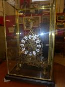 A skeleton clock within glass case