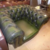A Chesterfield armchair upholstered in green button leather