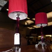 A pair of red stem glass table lamps and matching shades