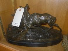 A bronze style figure of two stags rutting on marble support