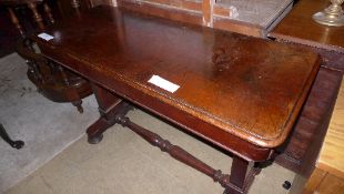 A Victorian mahogany library table the rectangular top on stretchered supports