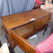 A C20th walnut sideboard with drawers and cupboards on cabriole supports