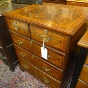 A C20th walnut chest having two short three long drawers on bracket feet W 72 D 46 H 88 cm