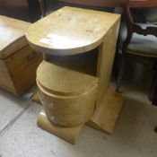 A blondewood Art Deco style bedside cabinet with two drawers