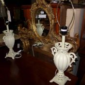 A pair of modern white table lamps