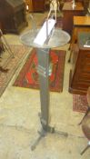 A mid C20th designer floor standing torchere bronze and cast metal