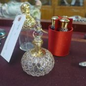 Two gold overlay glass perfume bottles in fabric case