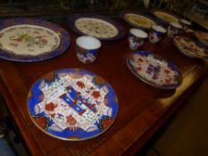 A collection of Imari style cups and plates with crown mark