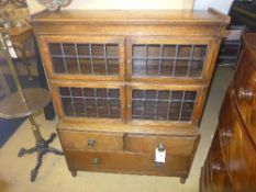 A Globe Wernicke bookcase the leaded glazed panels above drawers
