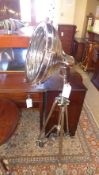 A large chromium studio tripod lamp (a/f)