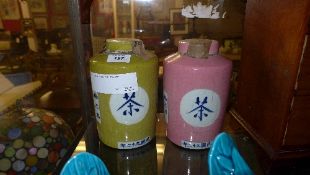 A pair of Chinese style tea holders