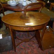 An Edwardian Sheraton Revival mahogany occasional table the oval top with hand painted genre