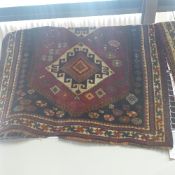 A fine old South West Persian Lori rug bearing triple pole medallion on a terracotta field guarded