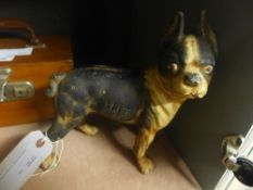 An antique bronzed dog door stop/coin holder
