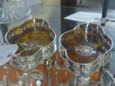 A pair of silver plated coasters