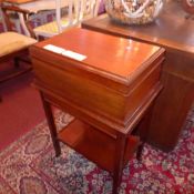 A mahogany work table the rectangular box top above an end drawer raised on square section supports