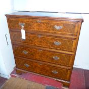 A Georgian style burr walnut and inlaid chest fitted four long drawers with brass plate handles on