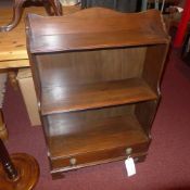 A mahogany waterfall style open bookcase with base drawer