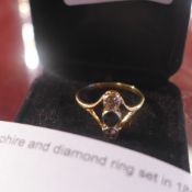 A sapphire and diamond ring set in 18ct gold