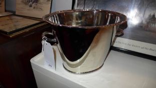A silver plated twin handled wine cooler of oval form