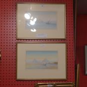 A pair of early C20th gouache Egyptian landscapes one of pyramids the other boats on the Nile signed