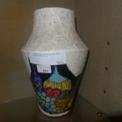 A 1950s Italian vase decorated with brightly coloured still life reserves