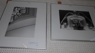 A pair of framed black and white photographs the first one depicting a waterfall the other depicting