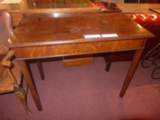 A George III mahogany side table raised on square section supports