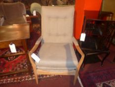 A pair of bleached walnut 1950's armchairs upholstered in grey linen fabric